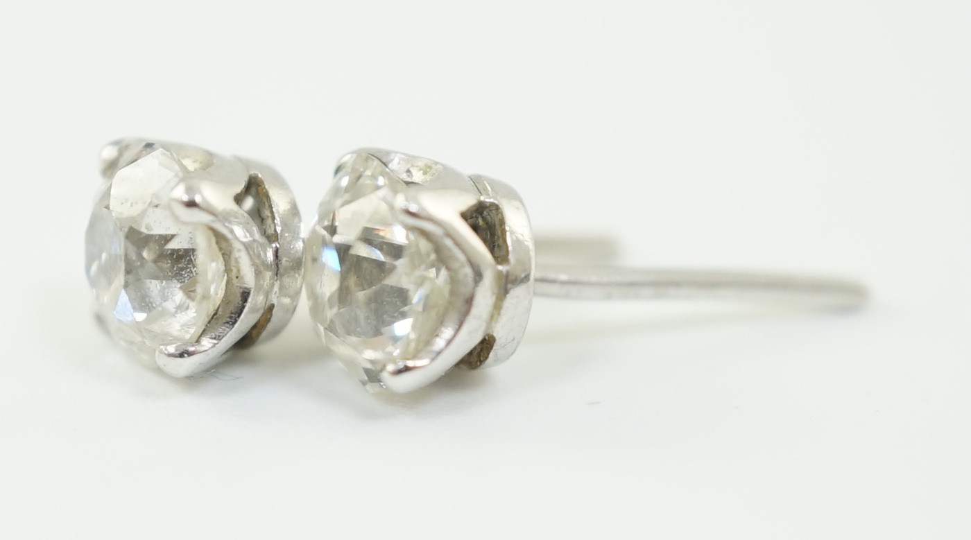 A pair of white gold? and solitaire diamond set ear studs